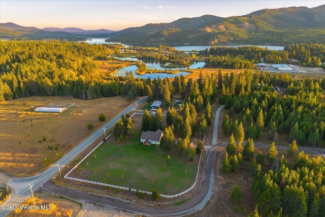 aerial view at dusk with a water and mountain view