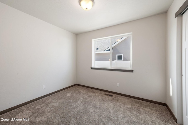 view of carpeted spare room