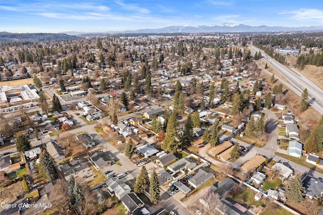 birds eye view of property with a mountain view