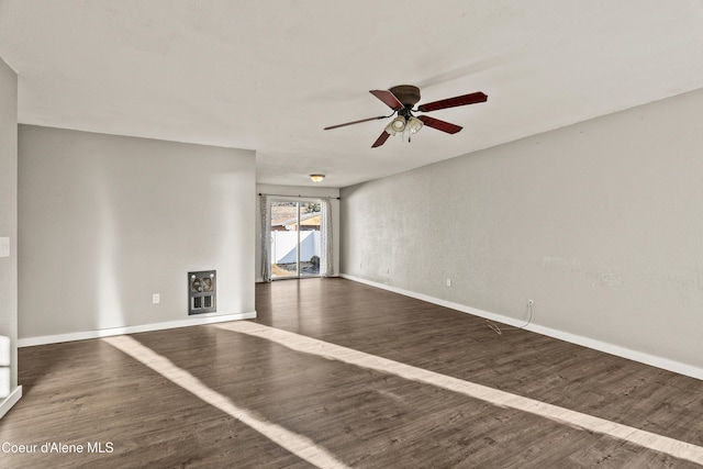 unfurnished living room with ceiling fan and dark hardwood / wood-style floors