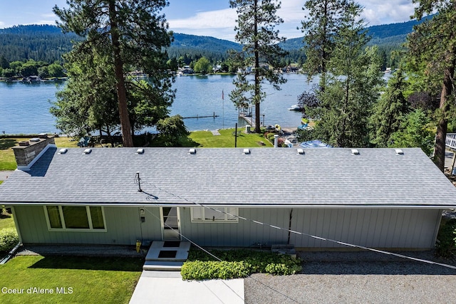 exterior space featuring a water and mountain view