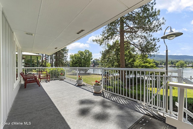 view of patio featuring a balcony