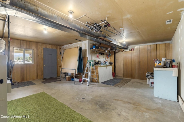 garage with wood walls