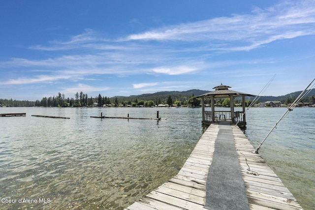 dock area with a gazebo and a water view