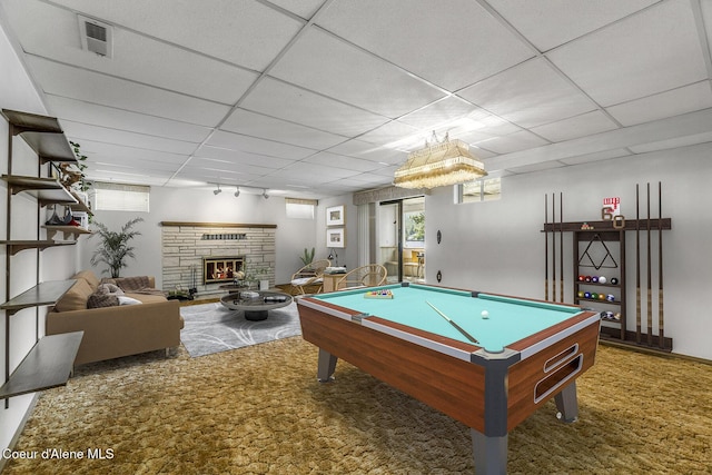 recreation room featuring a paneled ceiling, a fireplace, and billiards