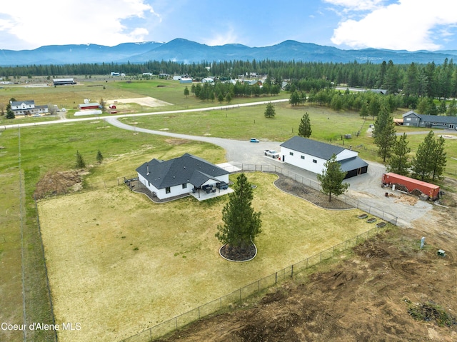 birds eye view of property featuring a mountain view and a rural view