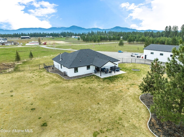 drone / aerial view with a mountain view and a rural view