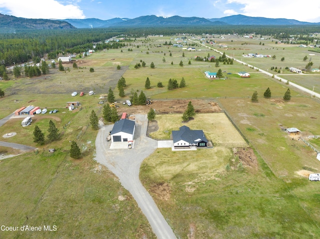 bird's eye view featuring a rural view and a mountain view