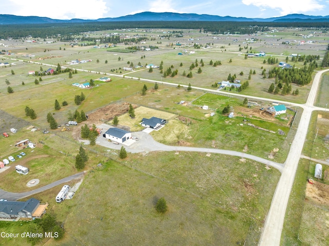 aerial view featuring a mountain view and a rural view