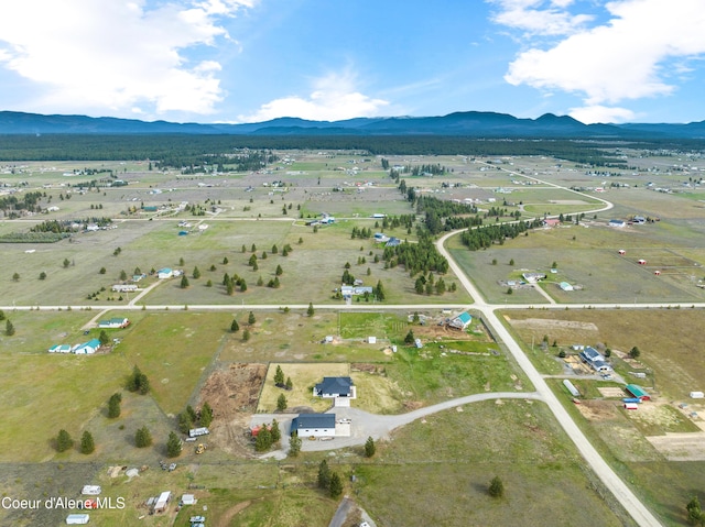 drone / aerial view featuring a rural view and a mountain view