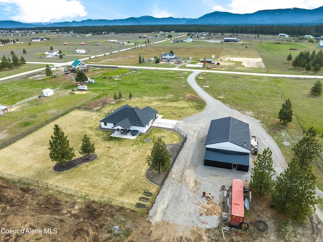 drone / aerial view with a mountain view and a rural view