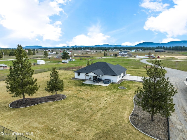 birds eye view of property with a mountain view