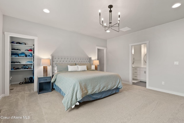 bedroom featuring light carpet, a notable chandelier, recessed lighting, and a spacious closet