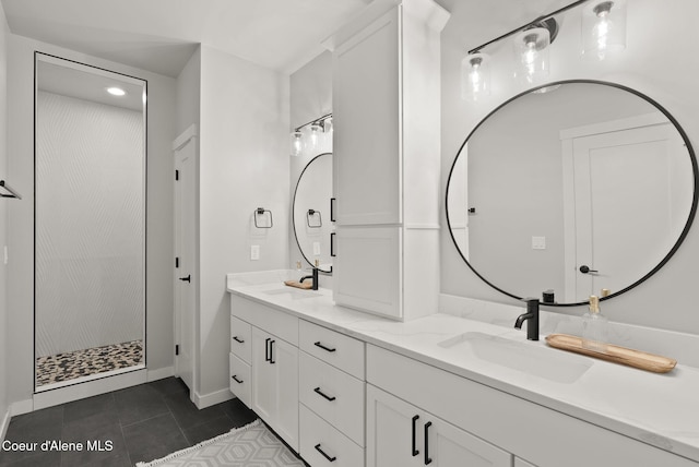full bathroom with tile patterned floors, double vanity, a sink, and walk in shower