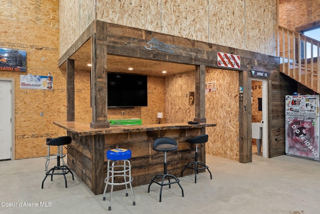 bar with concrete floors and bar