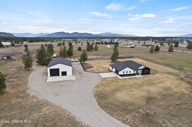 birds eye view of property with a rural view and a mountain view