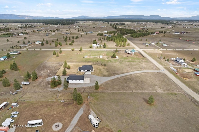 aerial view featuring a rural view and a mountain view