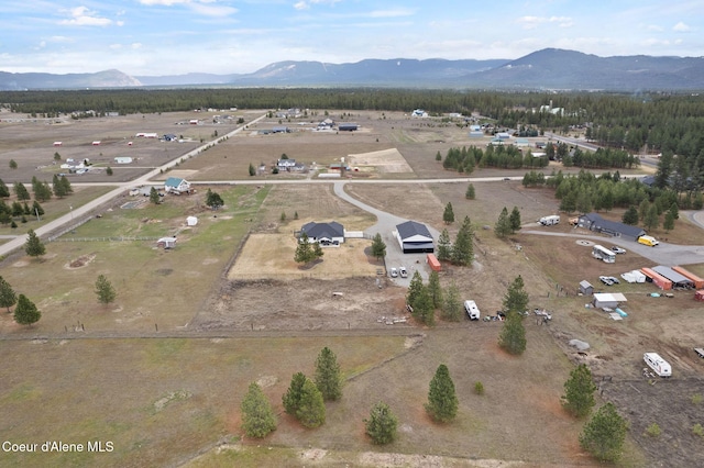 drone / aerial view featuring a rural view and a mountain view