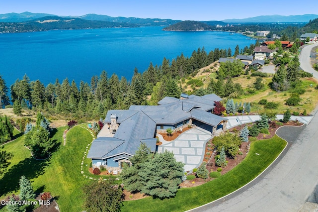 aerial view featuring a water and mountain view