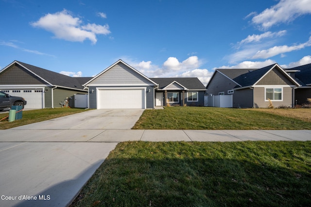 ranch-style home featuring a garage and a front lawn