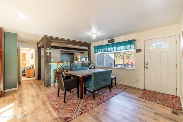 dining space with light hardwood / wood-style floors