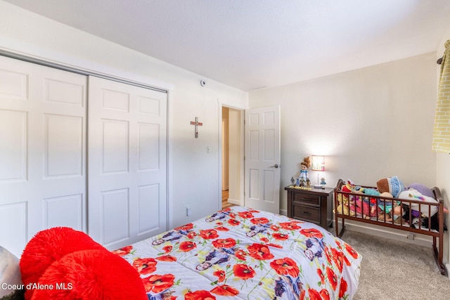 carpeted bedroom featuring a closet