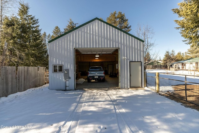 view of snow covered garage