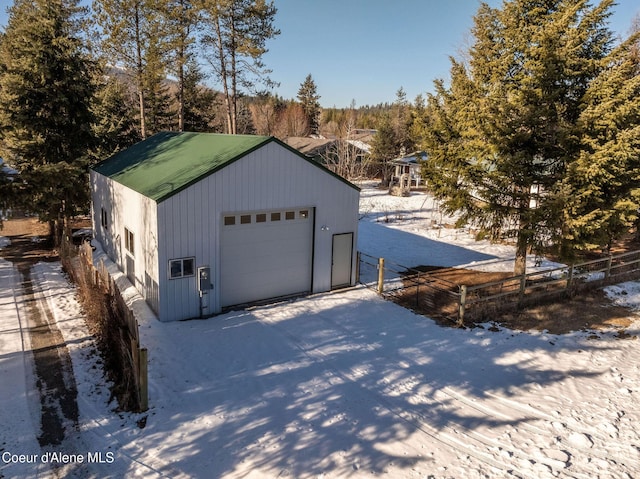 view of snow covered garage