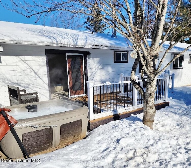 view of snow covered property entrance