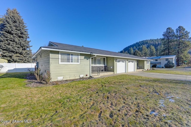 single story home with a garage and a front yard