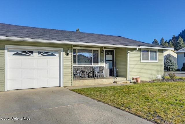 single story home with a garage, covered porch, and a front lawn