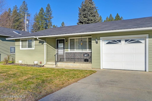 ranch-style home with a garage, covered porch, and a front lawn