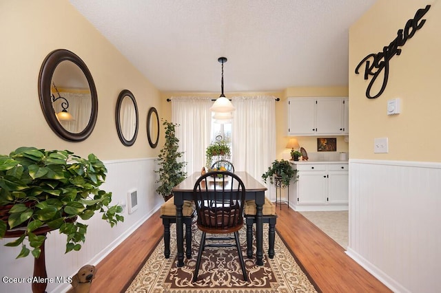 dining space with light wood-type flooring