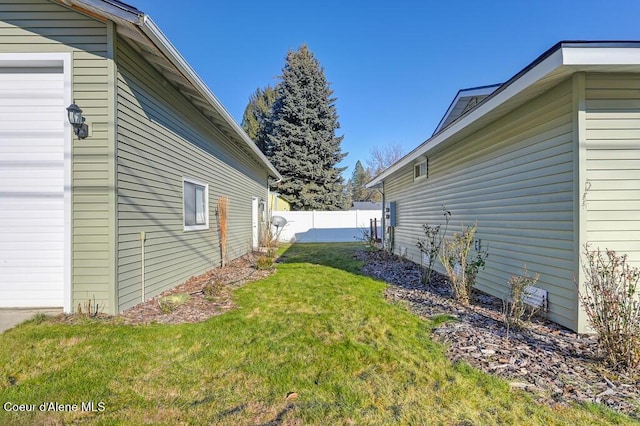 view of home's exterior with a lawn