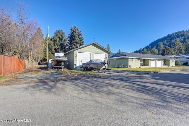 view of front of property featuring a garage and a mountain view