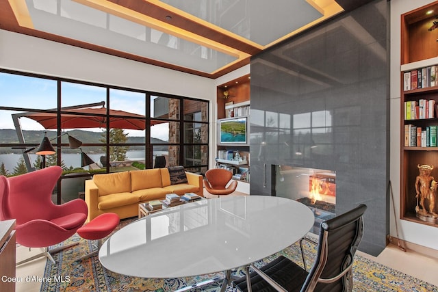 interior space with a water view and a high end fireplace