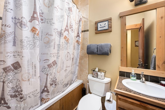 full bathroom with vanity, toilet, shower / tub combo, and backsplash