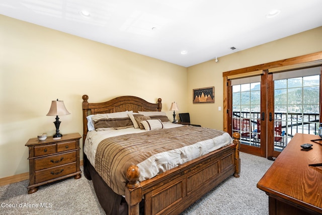 carpeted bedroom with access to outside