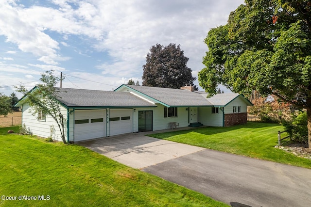 ranch-style home with a garage and a front yard