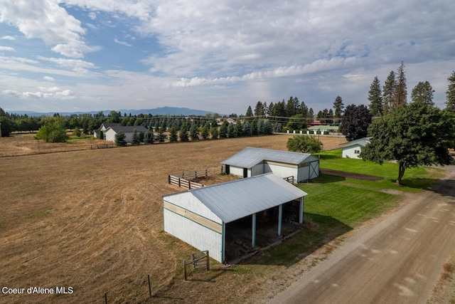 birds eye view of property featuring a rural view and a mountain view