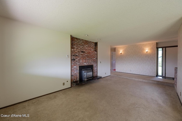 unfurnished living room with carpet floors and a textured ceiling