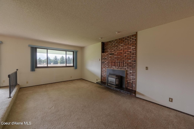 unfurnished living room with light colored carpet and a textured ceiling