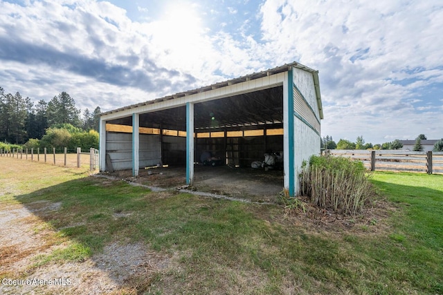 view of outdoor structure with a lawn