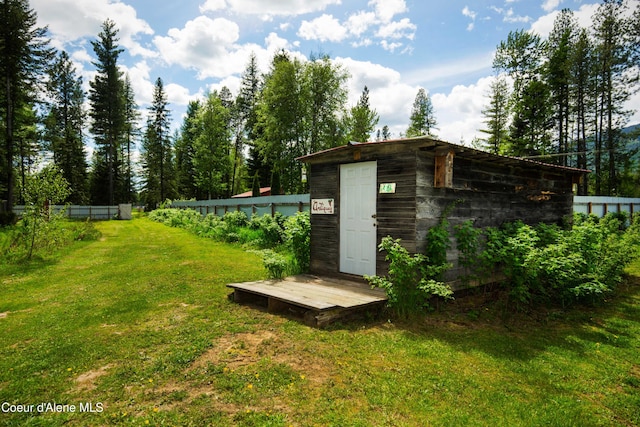 view of outdoor structure featuring a yard