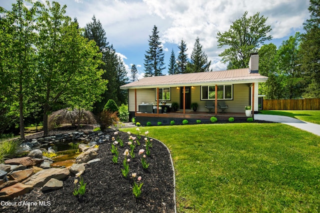 view of front of house with a front lawn and a porch