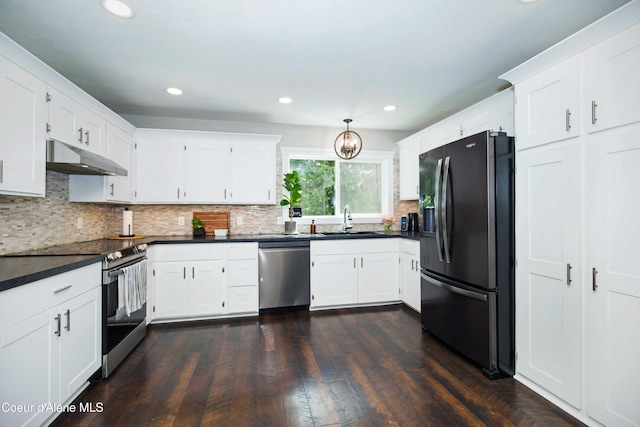 kitchen featuring decorative backsplash, sink, stainless steel appliances, and white cabinetry