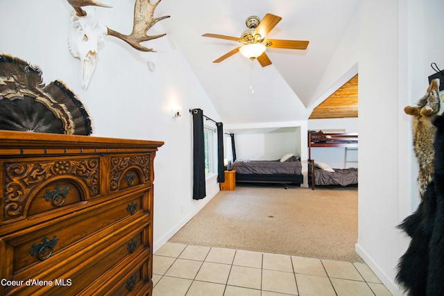 carpeted bedroom with ceiling fan and lofted ceiling