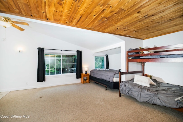 carpeted bedroom featuring vaulted ceiling and wooden ceiling