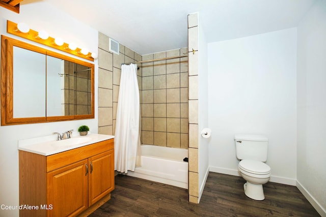 full bathroom featuring hardwood / wood-style floors, vanity, toilet, and shower / bath combo with shower curtain