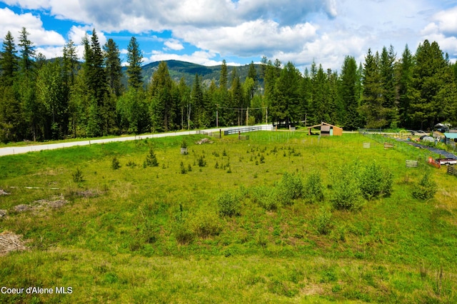mountain view featuring a rural view